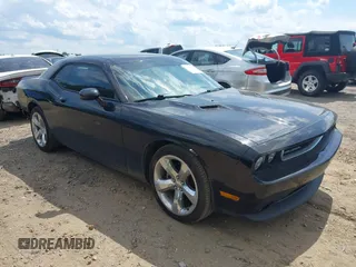 2014 Dodge Challenger R/T with VIN 2C3CDYBT3EH112029, listed as a IAAI auction lot 42449476 with 122,069 mi miles and . Bid and sale history available at DreamBid. Image 1.
