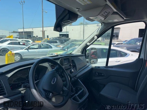 2023 Ford Transit Cargo with VIN 1FTBR1X87PKC09329, listed as a IAAI auction lot 42730748 with 10,638 mi miles and . Bid and sale history available at DreamBid. Image 2.