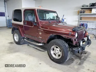 2002 Jeep Wrangler Sahara z VIN 1J4FA59S62P751858, wystawiony jako Copart lot #56638165 z przebiegiem 270 770 mil mil oraz Szkoda całkowita • Salvage title. Historia ofert i sprzedaży dostępna na DreamBid. Obrazek 4.