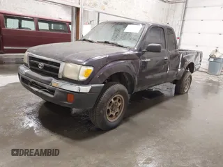 1999 Toyota Tacoma with VIN 4TAWM72N5XZ433296, listed as a IAAI auction lot 42595432 with 233,075 mi miles and . Bid and sale history available at DreamBid. Image 2.