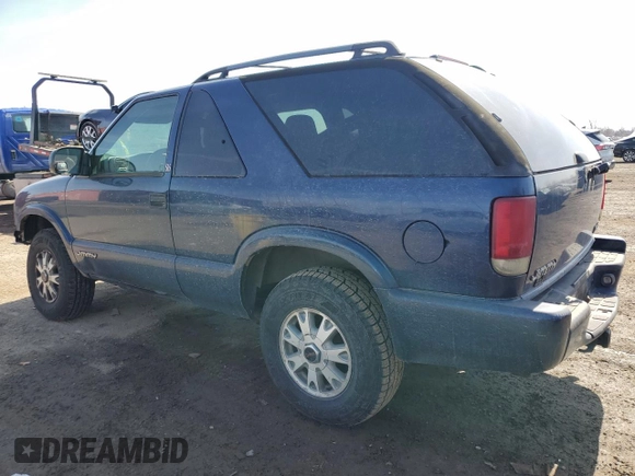 2003 GMC Jimmy z VIN 1GKCT18X43K110056, wystawiony jako Copart lot #48671585 z przebiegiem 272 867 mil mil oraz Czysty tytuł • Clean title. Historia ofert i sprzedaży dostępna na DreamBid. Obrazek 2.