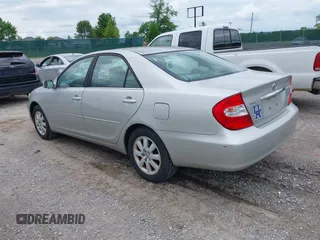 2003 Toyota Camry LE with VIN 4T1BE30K13U168509, listed as a IAAI auction lot 42220735 with 210,328 mi miles and . Bid and sale history available at DreamBid. Image 3.