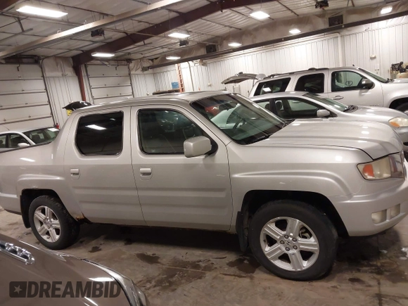 2009 Honda Ridgeline RTL with VIN 2HJYK16519H000129, listed as a IAAI auction lot 41891810 with 186,124 mi miles. Bid and sale history available at carsss.com. Image 13.
