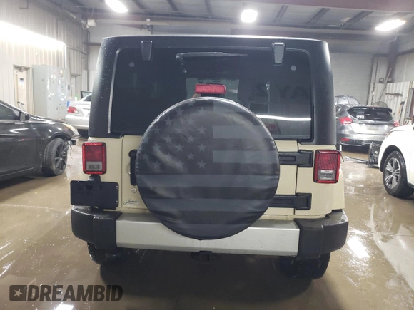 2011 Jeep Wrangler Sahara with VIN 1J4AA5D19BL577347, listed as a Copart auction lot 80340124 with 148,986 mi miles and Salvage Title. Bid and sale history available at DreamBid. Image 6.
