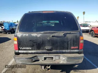 2001 GMC Yukon SLT z VIN 1GKEC13T41J148550, wystawiony jako Copart lot #80580964 z przebiegiem Nie podano mil oraz Szkoda całkowita • Salvage title. Historia ofert i sprzedaży dostępna na DreamBid. Obrazek 6.