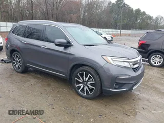 2021 Honda Pilot Touring 8-Passenger with VIN 5FNYF5H9XMB014190, listed as a IAAI auction lot 41749586 with 67,602 mi miles and . Bid and sale history available at DreamBid. Image 1.