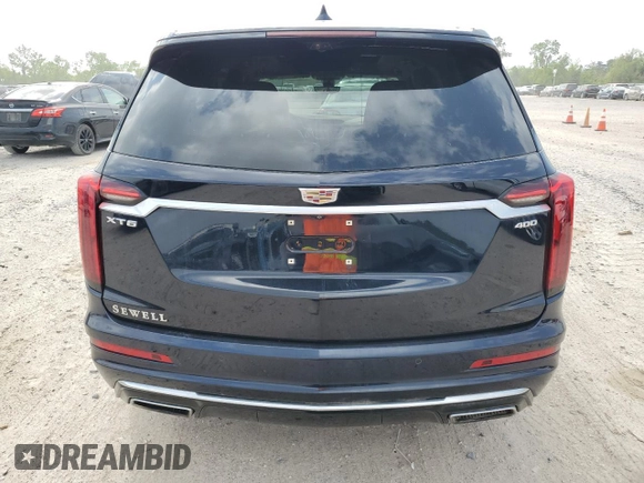 2022 Cadillac XT6 Premium Luxury z VIN 1GYKPERS4NZ105532, wystawiony jako Copart lot #51960895 z przebiegiem 99 336 mil mil oraz Szkoda całkowita • Salvage title. Historia ofert i sprzedaży dostępna na DreamBid. Obrazek 6.