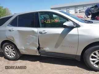 2018 Chevrolet Equinox LT z VIN 2GNAXJEV5J6309683, wystawiony jako IAAI lot #42238143 z przebiegiem 77 164 mil mil oraz . Historia ofert i sprzedaży dostępna na DreamBid. Obrazek 13.