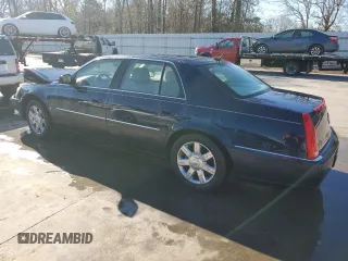2006 Cadillac DTS 1SB z VIN 1G6KD57Y56U220535, wystawiony jako Copart lot #89196185 z przebiegiem 94 312 mil mil oraz Szkody całkowita. Historia ofert i sprzedaży dostępna na DreamBid. Obrazek 2.