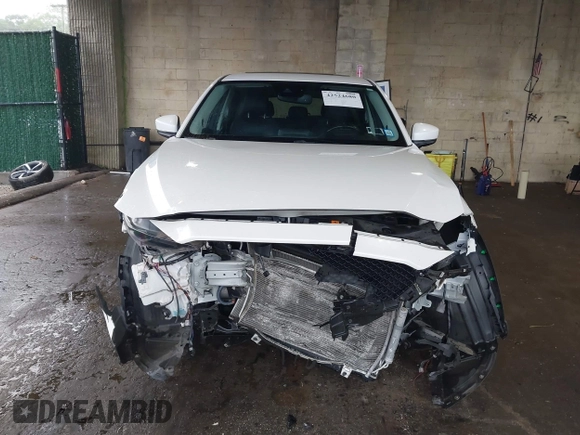 2019 Mazda CX-5 Grand Touring with VIN JM3KFBDMXK0648813, listed as a IAAI auction lot 42524680 with 23,521 mi miles and . Bid and sale history available at DreamBid. Image 13.