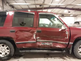 1999 GMC Yukon with VIN 1GKEK13R3XJ700930, listed as a IAAI auction lot 40915481 with 249,773 mi miles. Bid and sale history available at carsss.com. Image 6.