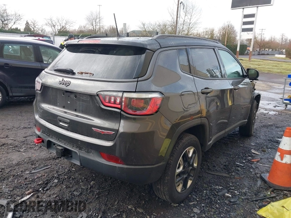 2017 Jeep Compass Trailhawk with VIN 3C4NJDDB9HT657173, listed as a IAAI auction lot 41613348 with 60,781 mi miles and . Bid and sale history available at DreamBid. Image 4.