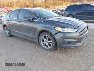 2015 Ford Fusion SE Hybrid with VIN 3FA6P0LU1FR219908, listed as a IAAI auction lot 41272688 with 310,452 mi miles. Bid and sale history available at carsss.com. Image 1.