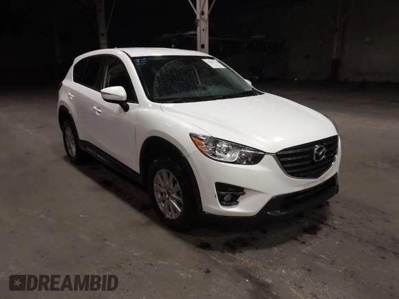 2016 Mazda CX-5 Touring z VIN JM3KE4CY0G0853261, wystawiony jako IAAI lot #41861176 z przebiegiem 63 491 mil mil oraz . Historia ofert i sprzedaży dostępna na DreamBid. Obrazek 1.