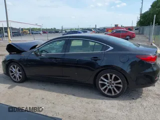 2016 Mazda Mazda6 i Touring with VIN JM1GJ1V53G1431880, listed as a IAAI auction lot 42079970 with 111,179 mi miles. Bid and sale history available at carsss.com. Image 14.