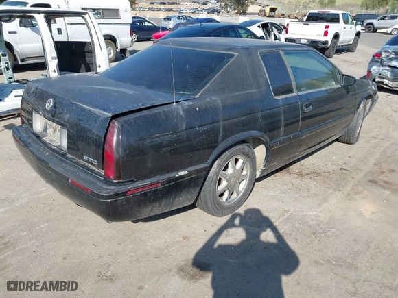 2001 Cadillac Eldorado Touring ETC with VIN 1G6ET12911B103774, listed as a IAAI auction lot 41998828 with 128,724 mi miles. Bid and sale history available at carsss.com. Image 4.
