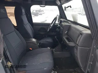2004 Jeep Wrangler SE with VIN 1J4FA29154P778915, listed as a IAAI auction lot 41245325 with 205,852 mi miles and . Bid and sale history available at DreamBid. Image 5.
