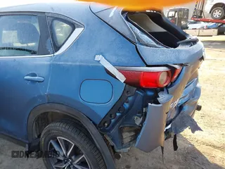 2018 Mazda CX-5 Touring z VIN JM3KFBCM2J0461954, wystawiony jako IAAI lot #41655865 z przebiegiem 129 333 mil mil oraz . Historia ofert i sprzedaży dostępna na DreamBid. Obrazek 16.