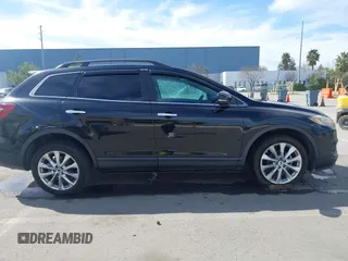 2015 Mazda CX-9 Grand Touring z VIN JM3TB2DA4F0450014, wystawiony jako IAAI lot #41692935 z przebiegiem 90 800 mil mil oraz . Historia ofert i sprzedaży dostępna na DreamBid. Obrazek 13.