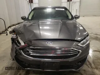 2018 Ford Fusion SE z VIN 3FA6P0HD6JR260522, wystawiony jako Copart lot #54382215 z przebiegiem 151 611 mil mil oraz Szkoda całkowita • Salvage title. Historia ofert i sprzedaży dostępna na DreamBid. Obrazek 5.