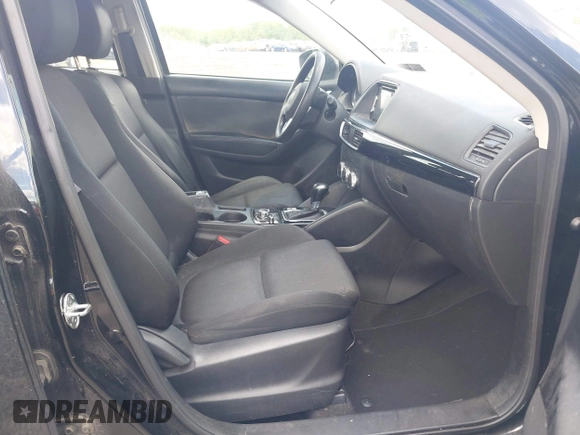 2016 Mazda CX-5 Sport with VIN JM3KE4BY2G0796577, listed as a IAAI auction lot 42230645 with 103,223 mi miles and . Bid and sale history available at DreamBid. Image 5.
