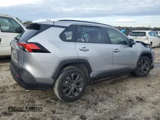 2023 Toyota RAV4 Hybrid XLE Premium z VIN JTMB6RFV8PD115723, wystawiony jako Copart lot #88005175 z przebiegiem 18 363 mil mil oraz Szkoda całkowita • Salvage title. Historia ofert i sprzedaży dostępna na DreamBid. Obrazek 3.