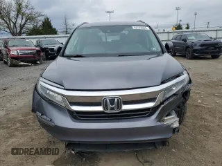 2020 Honda Pilot Touring 7-Passenger z VIN 5FNYF6H69LB005829, wystawiony jako Copart lot #52702555 z przebiegiem 90 746 mil mil oraz Szkoda całkowita • Salvage title. Historia ofert i sprzedaży dostępna na DreamBid. Obrazek 5.