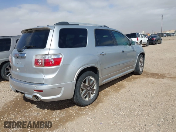 2011 GMC Acadia Denali with VIN 1GKKRTED5BJ402089, listed as a IAAI auction lot 41787001 with 165,030 mi miles and . Bid and sale history available at DreamBid. Image 4.