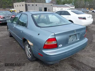1995 Honda Accord EX w/Leather with VIN 1HGCD5665SA132230, listed as a IAAI auction lot 41955713 with 101,999 mi miles. Bid and sale history available at carsss.com. Image 3.