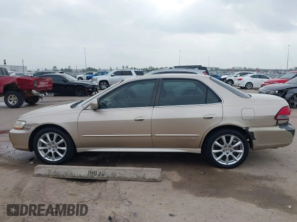 2001 Honda Accord EX z VIN 1HGCG165X1A077702, wystawiony jako IAAI lot #41770556 z przebiegiem 149 516 mil mil oraz . Historia ofert i sprzedaży dostępna na DreamBid. Obrazek 14.