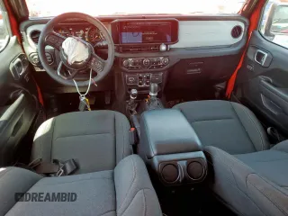 2024 Jeep Wrangler Sport S with VIN 1C4PJXDG3RW253142, listed as a Copart auction lot 52560035 with 2,667 mi miles and Salvage title. Bid and sale history available at DreamBid. Image 8.