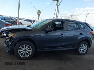 2014 Mazda CX-5 Touring with VIN JM3KE2CY9E0384401, listed as a IAAI auction lot 41699913 with 75,301 mi miles. Bid and sale history available at carsss.com. Image 14.
