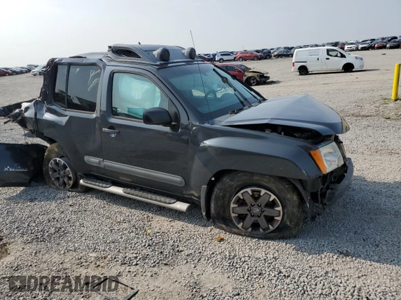 2015 Nissan Xterra Pro-4X z VIN 5N1AN0NWXFN664591, wystawiony jako Copart lot #60423525 z przebiegiem 246 477 mil mil oraz Szkoda całkowita • Salvage title. Historia ofert i sprzedaży dostępna na DreamBid. Obrazek 4.