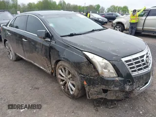 2013 Cadillac XTS Premium z VIN 2G61S5S31D9174211, wystawiony jako IAAI lot #42224495 z przebiegiem 120 012 mil mil oraz . Historia ofert i sprzedaży dostępna na DreamBid. Obrazek 1.