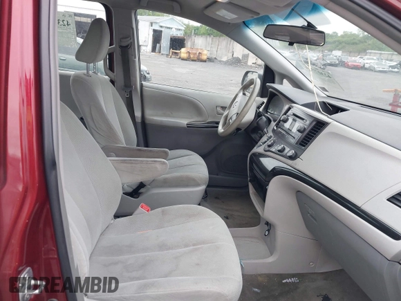 2014 Toyota Sienna L z VIN 5TDZK3DC2ES505680, wystawiony jako IAAI lot #42307763 z przebiegiem 170 628 mil mil oraz . Historia ofert i sprzedaży dostępna na DreamBid. Obrazek 5.