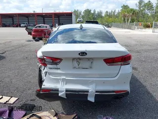 2018 Kia Optima LX z VIN 5XXGT4L39JG272694, wystawiony jako IAAI lot #42155363 z przebiegiem 115 417 mil mil oraz . Historia ofert i sprzedaży dostępna na DreamBid. Obrazek 16.
