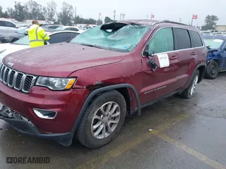 2021 Jeep Grand Cherokee Laredo X with VIN 1C4RJEAG4MC681989, listed as a IAAI auction lot 41571341 with 61,090 mi miles. Bid and sale history available at carsss.com. Image 2.