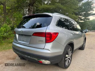 2018 Honda Pilot Touring z VIN 5FNYF6H94JB070661, wystawiony jako Copart lot #60926415 z przebiegiem 205 538 mil mil oraz Czysty tytuł • Clean title. Historia ofert i sprzedaży dostępna na DreamBid. Obrazek 4.