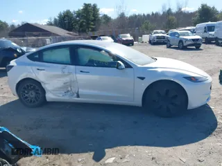 2025 Tesla Model 3 Long Range with VIN 5YJ3E1EA7SF923943, listed as a IAAI auction lot 42040876 with 1,547 mi miles and . Bid and sale history available at DreamBid. Image 12.