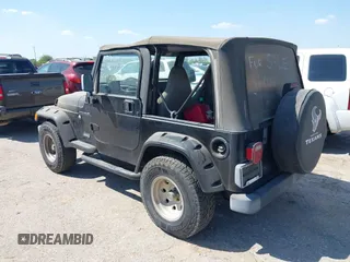 1998 Jeep Wrangler SE with VIN 1J4FY29P1WP806244, listed as a IAAI auction lot 41885627 with 131,486 mi miles. Bid and sale history available at carsss.com. Image 3.