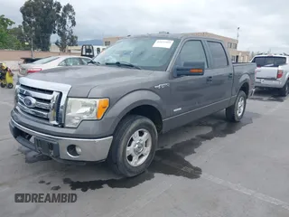 2011 Ford F-150 XLT with VIN 1FTFW1CT8BKD21411, listed as a IAAI auction lot 42077959 with 152,665 mi miles. Bid and sale history available at carsss.com. Image 2.