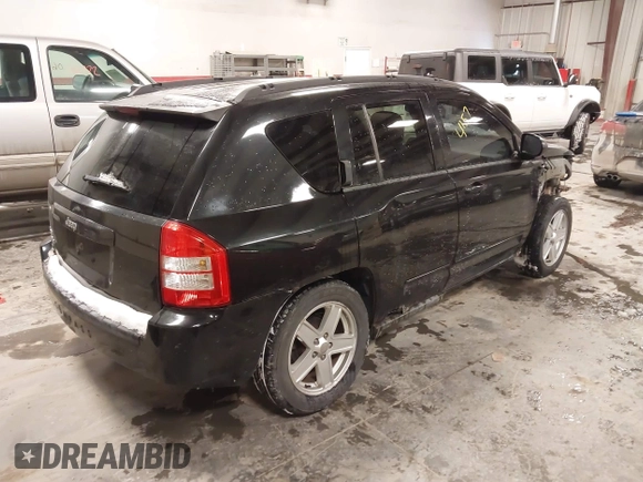 2010 Jeep Compass Sport with VIN 1J4NF4FB0AD501897, listed as a IAAI auction lot 41570009 with 198,376 mi miles. Bid and sale history available at carsss.com. Image 4.