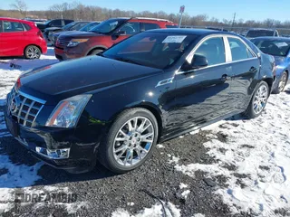 2013 Cadillac CTS Premium z VIN 1G6DS5E34D0160676, wystawiony jako IAAI lot #41262795 z przebiegiem 122 248 mil mil oraz . Historia ofert i sprzedaży dostępna na DreamBid. Obrazek 17.