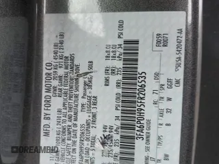 2015 Ford Fusion SE z VIN 3FA6P0H95FR206535, wystawiony jako Copart lot #54242105 z przebiegiem 83 001 mil mil oraz Szkoda całkowita • Salvage title. Historia ofert i sprzedaży dostępna na DreamBid. Obrazek 13.