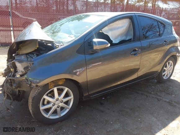 2014 Toyota Prius c One with VIN JTDKDTB32E1561856, listed as a IAAI auction lot 41591107 with 104,363 mi miles. Bid and sale history available at carsss.com. Image 18.