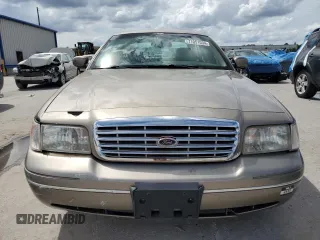 2003 Ford Crown Victoria LX с VIN 2FAHP74W63X124565, выставлен на аукционе Copart как лот 71051034 с пробегом 89 976 миль миль и Списание • Salvage title. История ставок и продаж доступна на DreamBid. Изображение 5.
