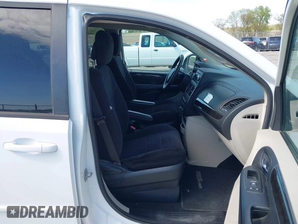 2014 Dodge Grand Caravan American Value with VIN 2C4RDGBG8ER140342, listed as a IAAI auction lot 42198306 with 135,564 mi miles and . Bid and sale history available at DreamBid. Image 5.