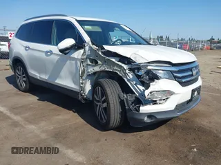 2018 Honda Pilot Touring with VIN 5FNYF6H95JB019122, listed as a IAAI auction lot 42439283 with 128,848 mi miles and . Bid and sale history available at DreamBid. Image 1.