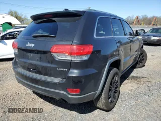 2014 Jeep Grand Cherokee Laredo with VIN 1C4RJFAG4EC210321, listed as a Copart auction lot 53574595 with 119,650 mi miles and Salvage Title. Bid and sale history available at DreamBid. Image 3.