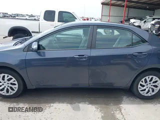2018 Toyota Corolla L with VIN 5YFBURHE8JP770696, listed as a IAAI auction lot 42386025 with 63,224 mi miles and . Bid and sale history available at DreamBid. Image 14.